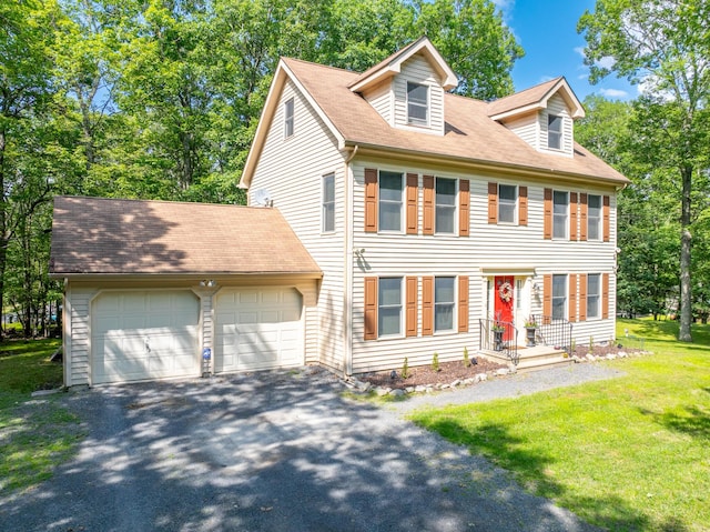 1154 Park Dr, East Stroudsburg, PA 18302 - view of front of home with a garage, asphalt driveway, a front lawn, and roof with shingles