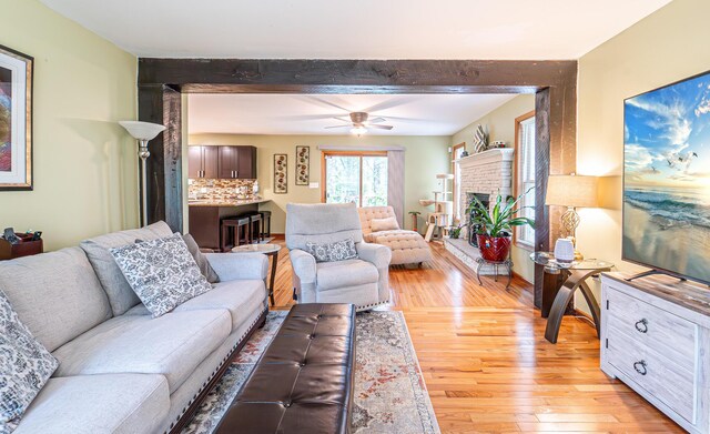 1154 Park Dr, East Stroudsburg, PA 18302 - living area featuring light wood-type flooring, ceiling fan, and beam ceiling
