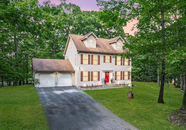 1154 Park Dr, East Stroudsburg, PA 18302 - colonial inspired home featuring an attached garage, asphalt driveway, and a front yard
