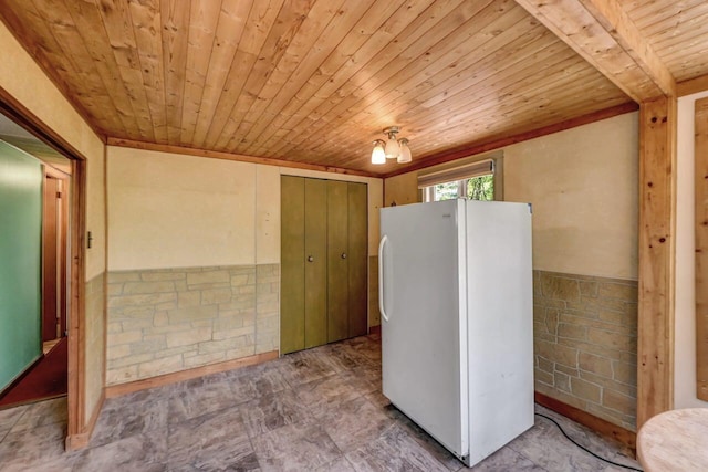 209 Cross St, Pocono Lake, PA 18347 - kitchen featuring freestanding refrigerator, wood ceiling, and wainscoting