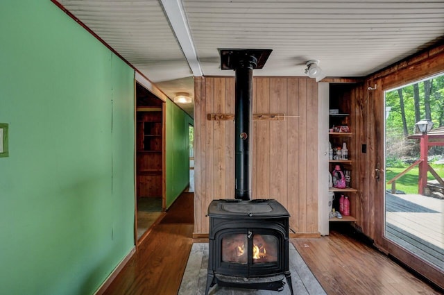 209 Cross St, Pocono Lake, PA 18347 - detailed view of a wood stove, wood finished floors, and wooden walls