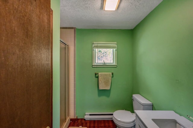 209 Cross St, Pocono Lake, PA 18347 - bathroom with baseboard heating, toilet, a stall shower, a textured ceiling, and vanity