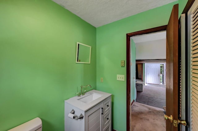 209 Cross St, Pocono Lake, PA 18347 - bathroom with vanity, toilet, and a textured ceiling