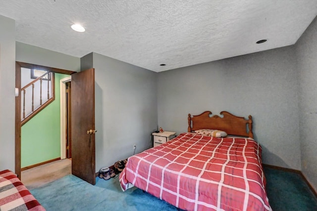 209 Cross St, Pocono Lake, PA 18347 - carpeted bedroom featuring a textured ceiling and baseboards