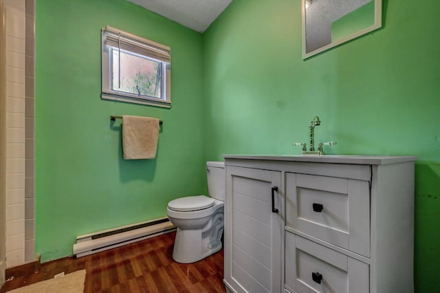 209 Cross St, Pocono Lake, PA 18347 - full bath with a baseboard heating unit, toilet, vanity, wood finished floors, and a shower