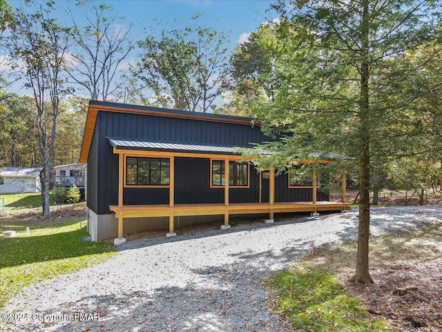 view of front of home with a standing seam roof and metal roof