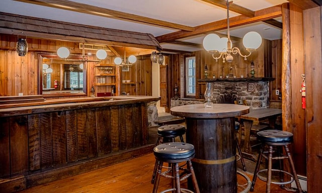 2735 Rte 390, Canadensis, PA 18325 - indoor wet bar with wood-type flooring, wood walls, beamed ceiling, a chandelier, and pendant lighting