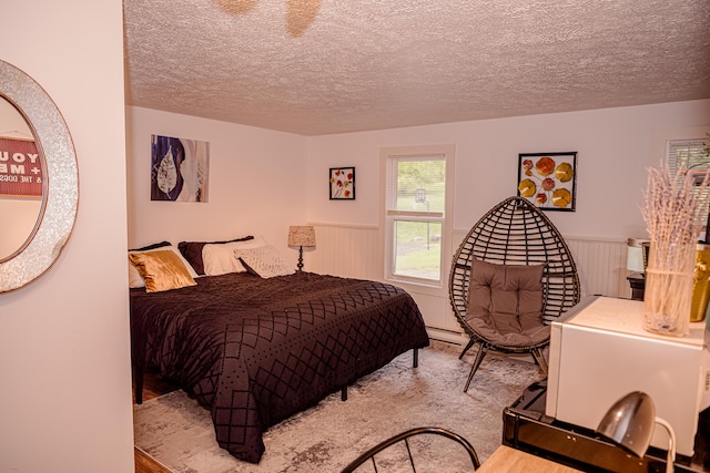 2735 Rte 390, Canadensis, PA 18325 - bedroom featuring wainscoting and a textured ceiling
