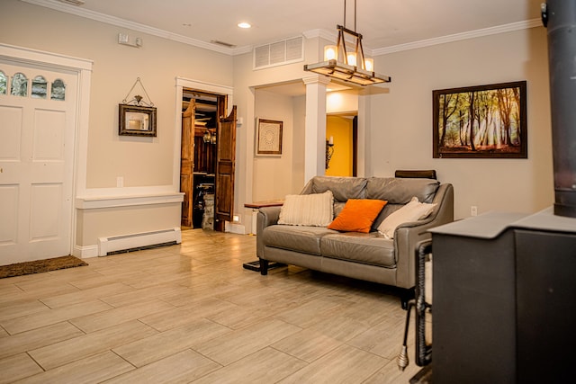 2735 Rte 390, Canadensis, PA 18325 - living area featuring a baseboard radiator, ornate columns, light wood-style flooring, ornamental molding, and recessed lighting