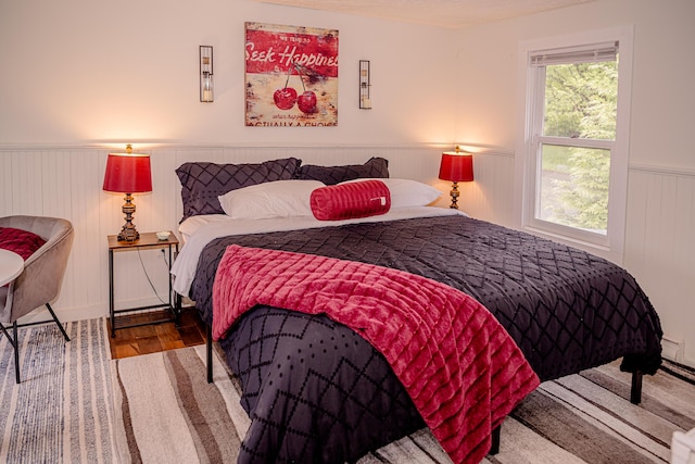 2735 Rte 390, Canadensis, PA 18325 - bedroom with a wainscoted wall and wood finished floors
