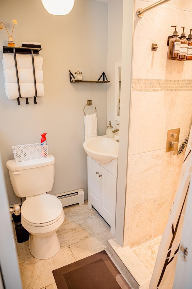 2735 Rte 390, Canadensis, PA 18325 - bathroom with a baseboard radiator, vanity, a tile shower, and toilet