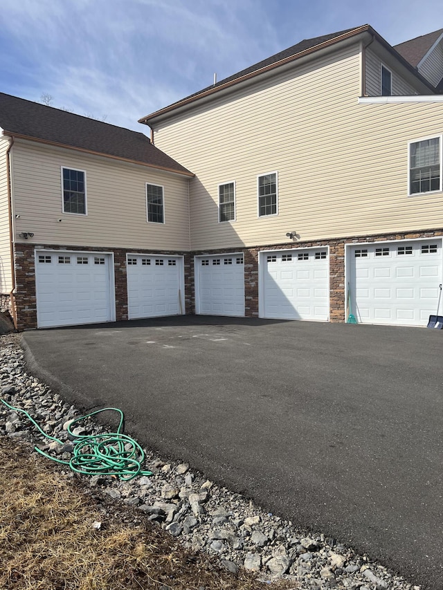 garage featuring driveway