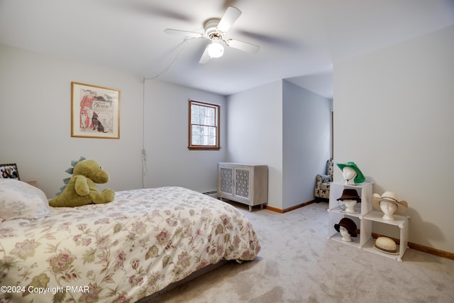 carpeted bedroom with ceiling fan and baseboards