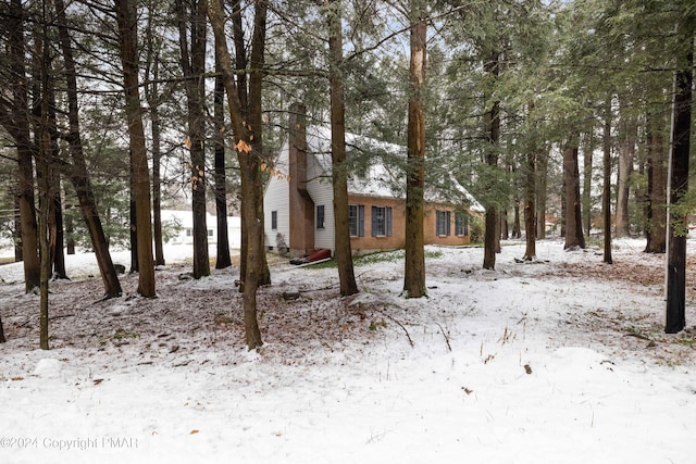 view of yard layered in snow