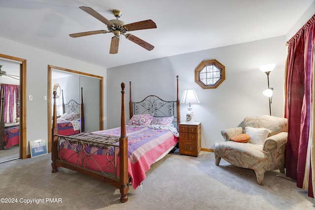 carpeted bedroom with a closet and a ceiling fan