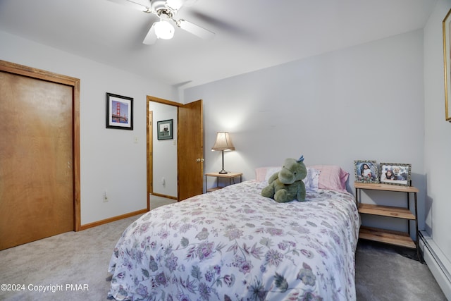 carpeted bedroom featuring ceiling fan, baseboards, and baseboard heating