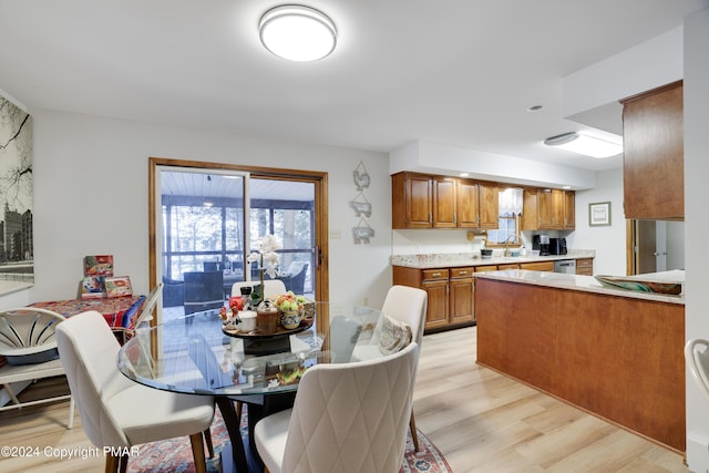 dining room featuring light wood-style flooring