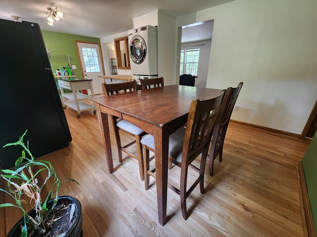 9 Theocritus Cir, Albrightsville, PA 18210 - dining space featuring stacked washer and clothes dryer, plenty of natural light, and light wood-type flooring