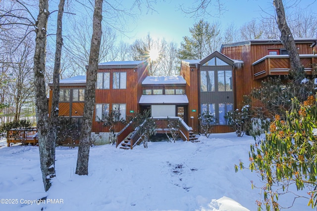 view of snow covered house