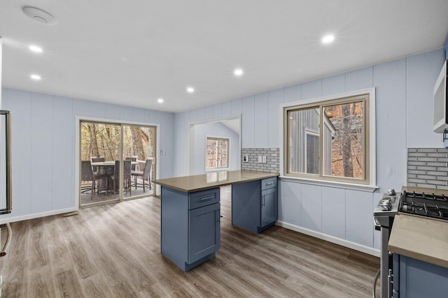 2094 Scarborough Way, Bushkill, PA 18324 - kitchen featuring recessed lighting, blue cabinetry, stainless steel gas range oven, and wood finished floors