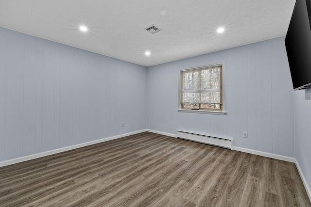 2094 Scarborough Way, Bushkill, PA 18324 - unfurnished room with recessed lighting, visible vents, wood finished floors, and a baseboard radiator