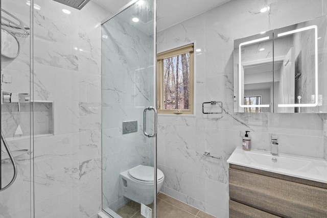 2094 Scarborough Way, Bushkill, PA 18324 - full bathroom featuring vanity, tile patterned flooring, toilet, tile walls, and a marble finish shower
