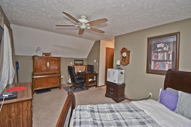 bedroom featuring a textured ceiling, vaulted ceiling, ceiling fan, and light carpet