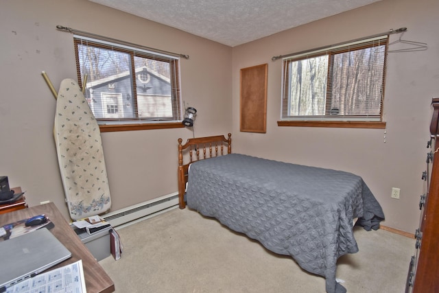 bedroom featuring carpet flooring, baseboards, a baseboard radiator, and a textured ceiling