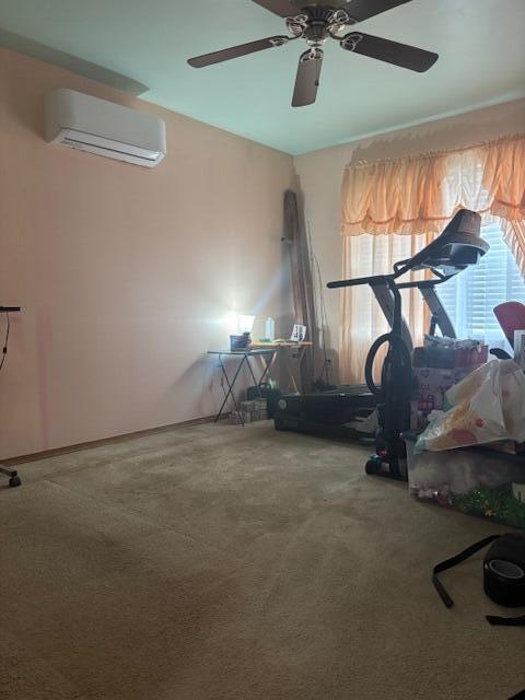 exercise area with carpet, a wall mounted AC, and ceiling fan