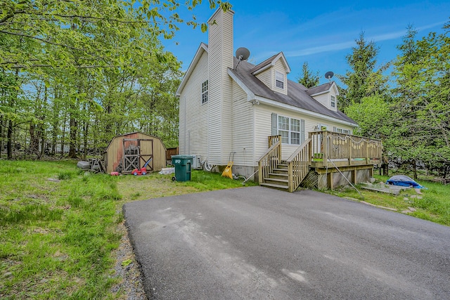 6163 Somers Ter, Tobyhanna, PA 18466 - view of front of home with a wooden deck and a chimney