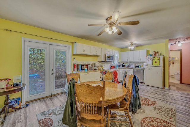 6163 Somers Ter, Tobyhanna, PA 18466 - dining space featuring light wood-style floors, french doors, ceiling fan, and a baseboard heating unit