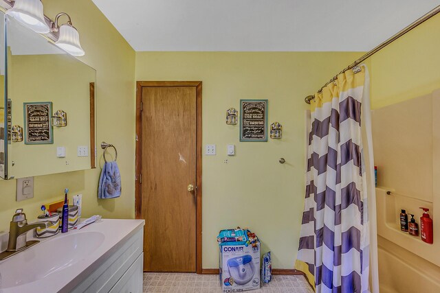 6163 Somers Ter, Tobyhanna, PA 18466 - bathroom featuring vanity, shower / bath combo, and tile patterned floors