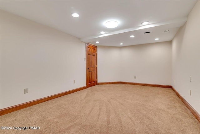 unfurnished room with recessed lighting, light colored carpet, and baseboards