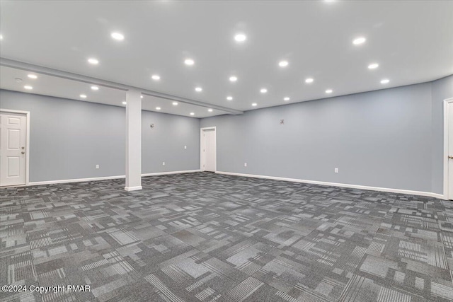 below grade area with recessed lighting, carpet flooring, and baseboards