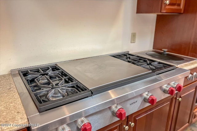 kitchen featuring light countertops and brown cabinetry