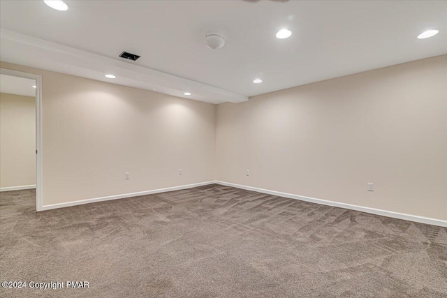 carpeted empty room with baseboards and recessed lighting