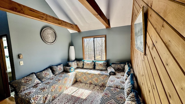 bedroom with vaulted ceiling with beams