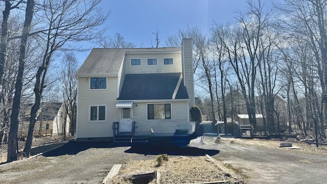 1905 Horseshoe Bnd, Tobyhanna, PA 18466 - view of front of house featuring a chimney and roof with shingles