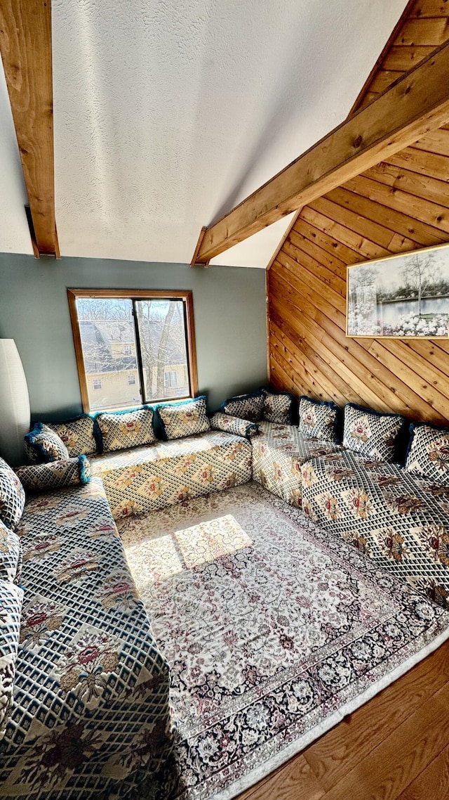 living room featuring lofted ceiling with beams