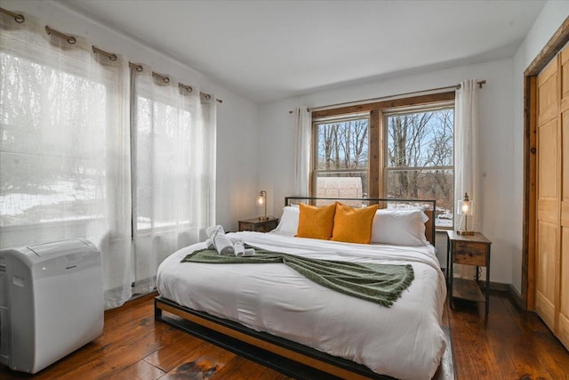 bedroom with hardwood / wood-style flooring