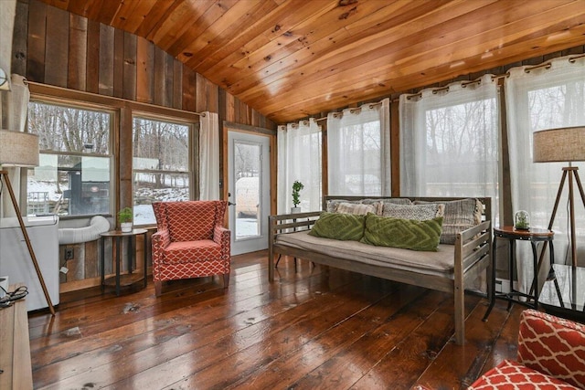 sunroom / solarium featuring wooden ceiling, hardwood / wood-style floors, and vaulted ceiling