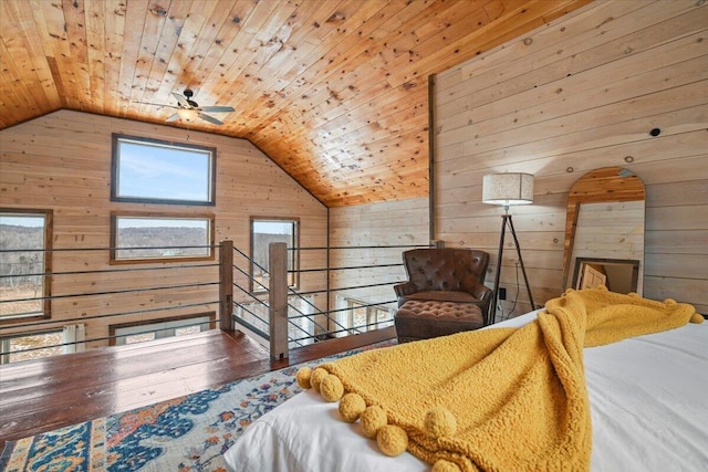 bedroom featuring wooden walls, wooden ceiling, and lofted ceiling