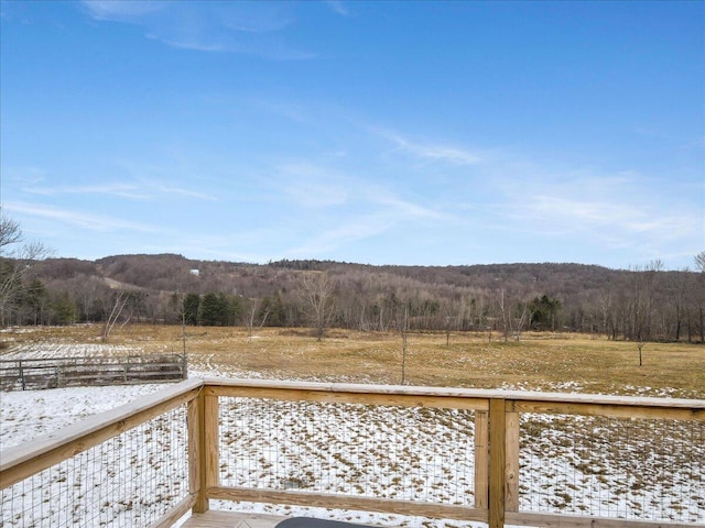 exterior space with a wooded view