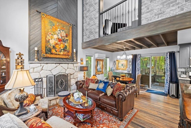 1237 Brentwood Dr, East Stroudsburg, PA 18301 - living area with a towering ceiling, wood finished floors, beamed ceiling, and a fireplace