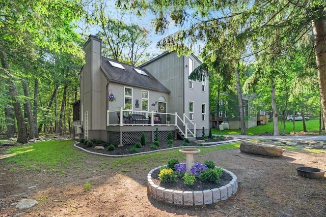 1237 Brentwood Dr, East Stroudsburg, PA 18301 - rear view of house with a deck, a chimney, and roof with shingles