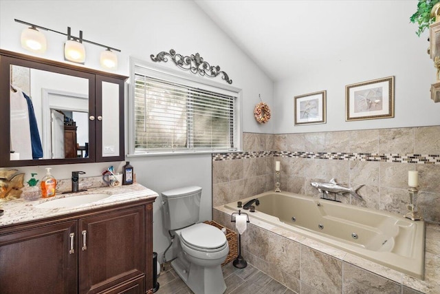 1237 Brentwood Dr, East Stroudsburg, PA 18301 - bathroom featuring a whirlpool tub, vanity, toilet, and vaulted ceiling