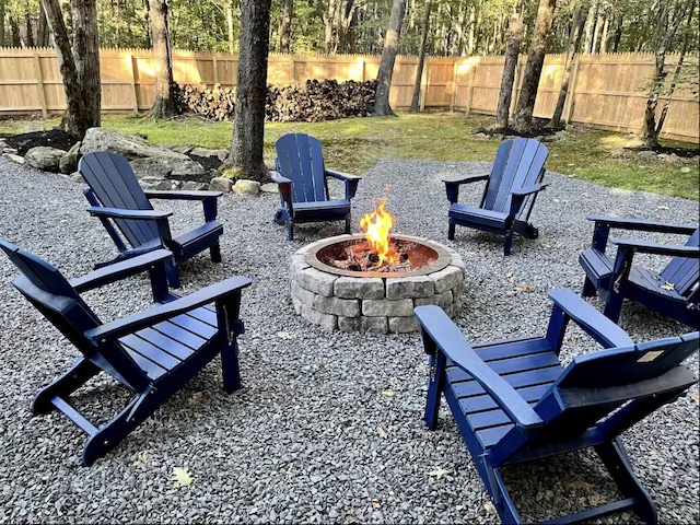 view of patio with a fenced backyard and an outdoor fire pit
