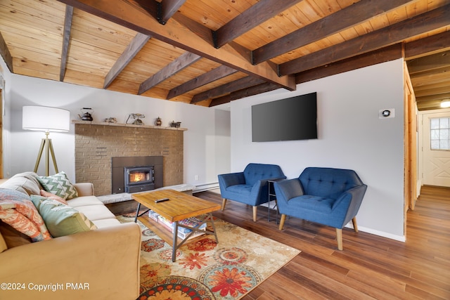 living room with wood ceiling, baseboards, and wood finished floors