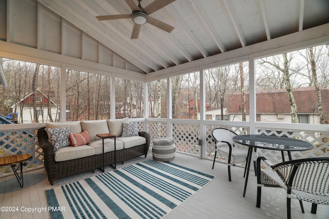 sunroom with vaulted ceiling and ceiling fan