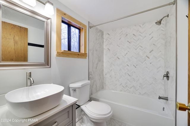 bathroom with toilet, vanity, and shower / bathtub combination